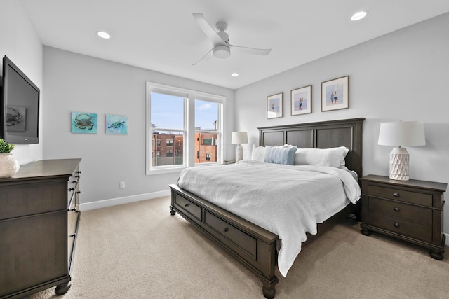 bedroom featuring ceiling fan and light colored carpet