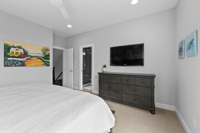 carpeted bedroom featuring connected bathroom and ceiling fan