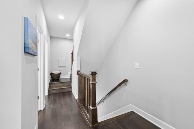 hallway with dark hardwood / wood-style flooring