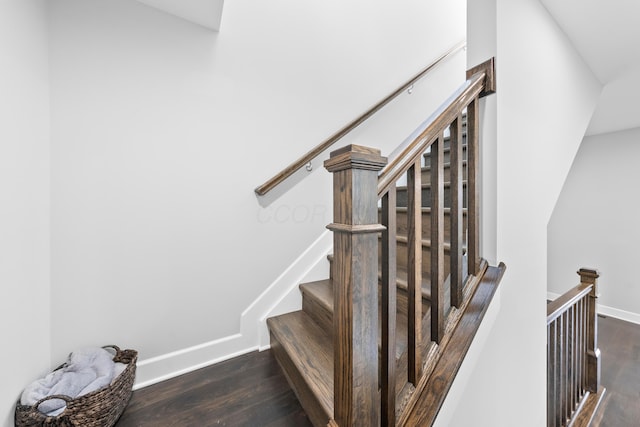 staircase featuring hardwood / wood-style floors