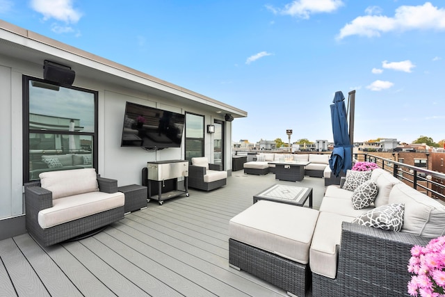 wooden terrace with outdoor lounge area