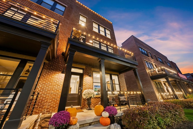 view of outdoor building at dusk