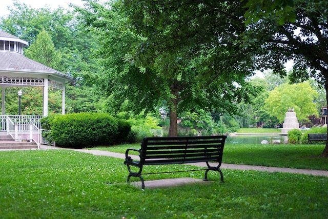 view of property's community with a lawn