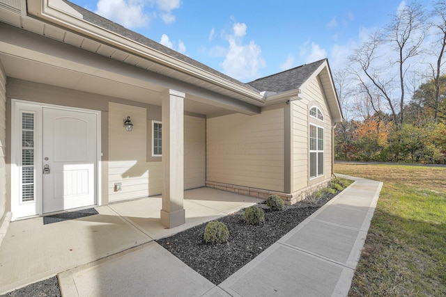 entrance to property with a yard