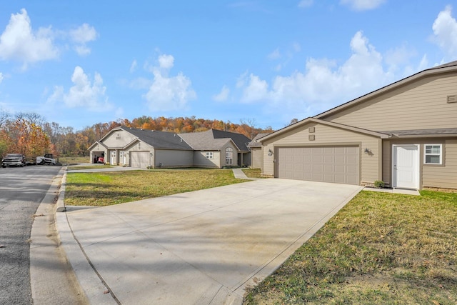 ranch-style home with a garage and a front yard