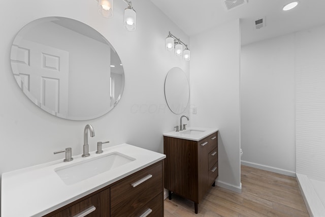 bathroom featuring hardwood / wood-style floors and vanity