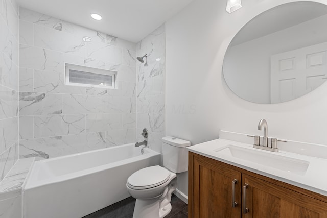 full bathroom with vanity, toilet, and tiled shower / bath combo