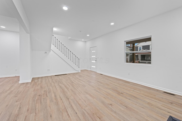 unfurnished living room featuring light wood-type flooring