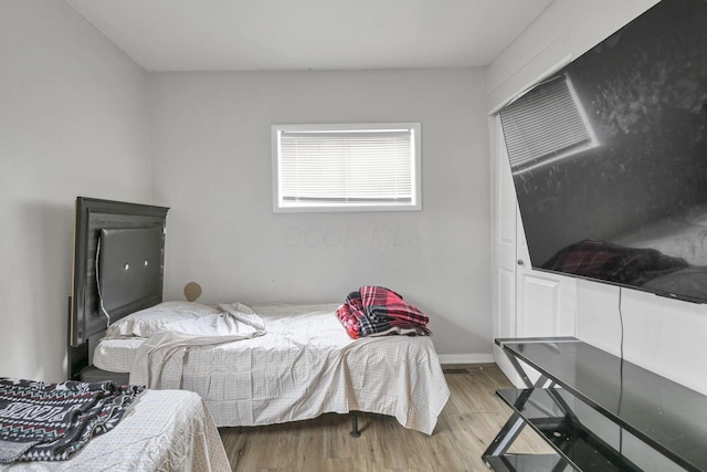 bedroom with light hardwood / wood-style flooring