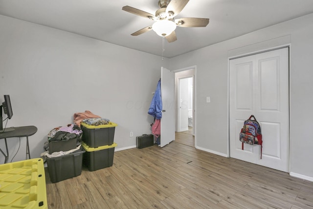 playroom featuring ceiling fan and hardwood / wood-style flooring