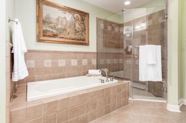 bathroom featuring separate shower and tub and tile patterned floors