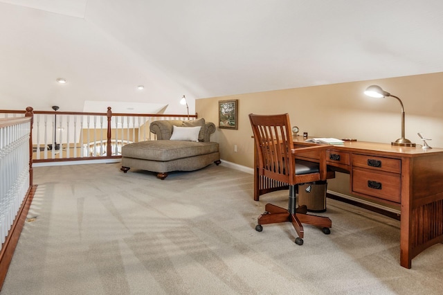 office area featuring light carpet and lofted ceiling