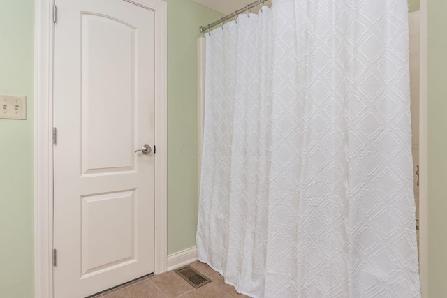 bathroom featuring tile patterned flooring