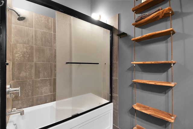 bathroom with shower / bath combination with glass door