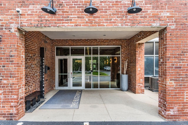 property entrance with french doors and cooling unit