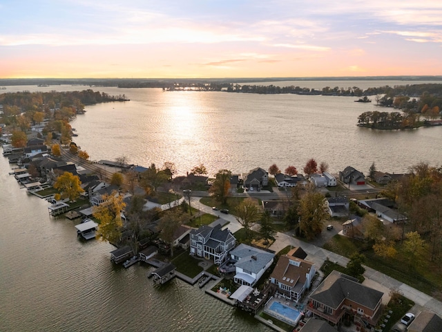 aerial view at dusk with a water view