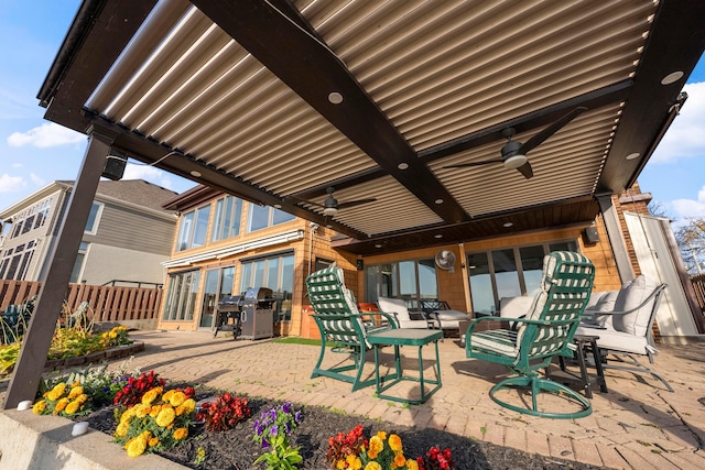 view of patio featuring area for grilling and ceiling fan