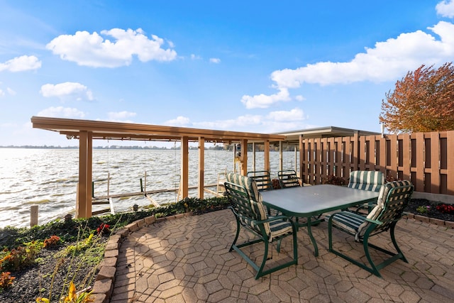 view of patio featuring a water view