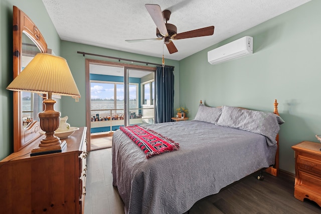 bedroom featuring hardwood / wood-style floors, ceiling fan, access to exterior, a textured ceiling, and a wall mounted AC