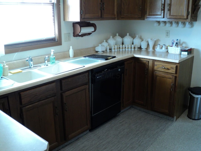 kitchen featuring black dishwasher and sink