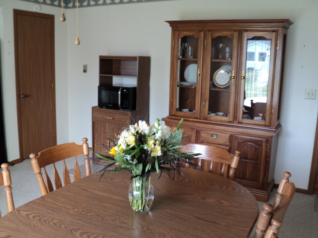 view of carpeted dining space