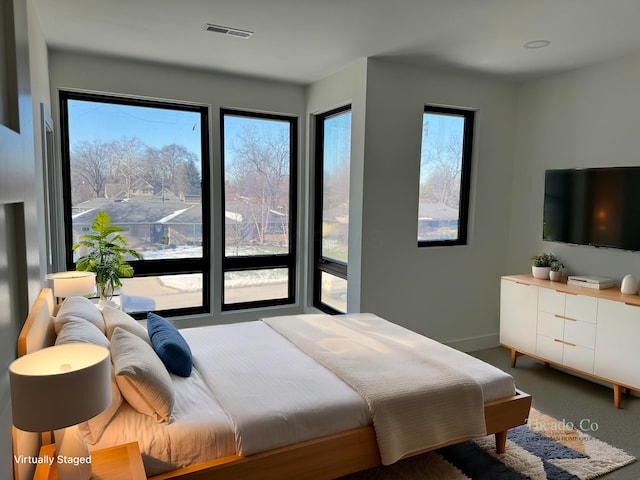 bedroom with carpet and visible vents