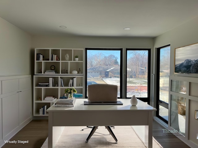 office with a wealth of natural light and wood finished floors