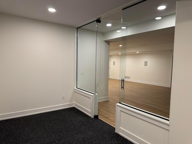 unfurnished room featuring recessed lighting, visible vents, and baseboards