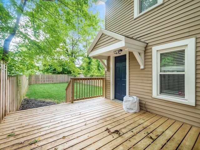 wooden terrace with a lawn