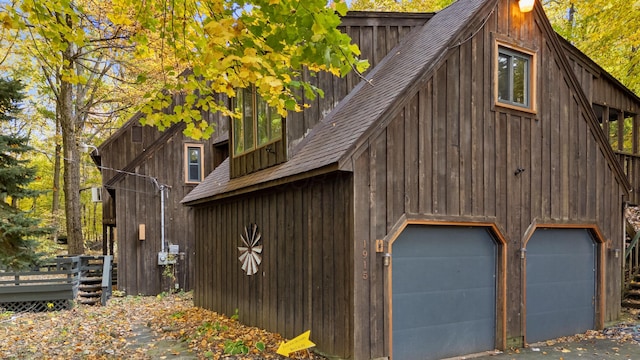 view of property exterior featuring a garage