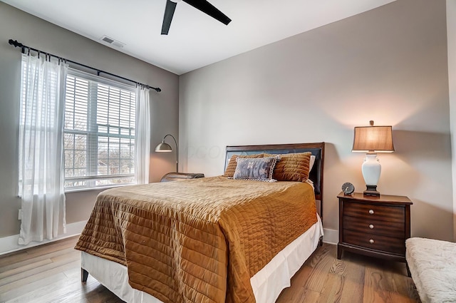 bedroom featuring hardwood / wood-style flooring and ceiling fan