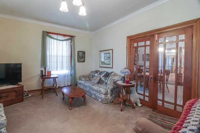 living room featuring a chandelier, french doors, carpet floors, and crown molding