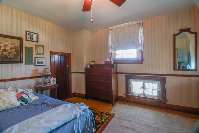 bedroom featuring light hardwood / wood-style flooring and ceiling fan