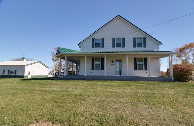 farmhouse inspired home featuring a front yard and a porch