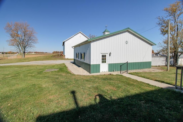 view of side of property with a yard