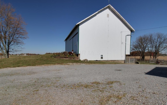 view of home's exterior with an outbuilding