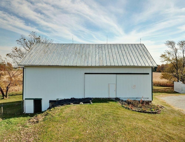 garage featuring a lawn