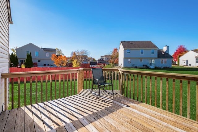 wooden terrace with a lawn