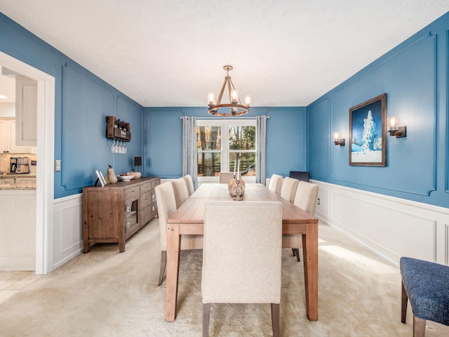 carpeted dining space featuring a textured ceiling and an inviting chandelier