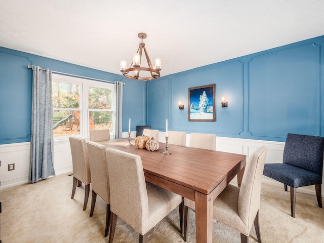 dining room with light colored carpet and an inviting chandelier