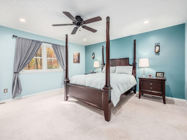 bedroom featuring light carpet and ceiling fan