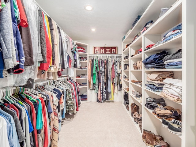 walk in closet featuring carpet