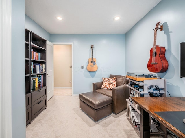 living area featuring light colored carpet