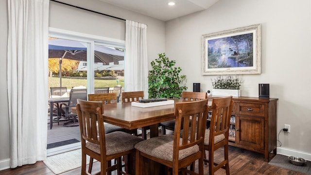 dining space featuring dark hardwood / wood-style flooring