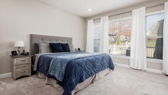 bedroom featuring light carpet