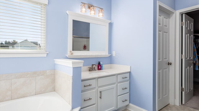 bathroom featuring shower with separate bathtub, vanity, tile patterned floors, and a wealth of natural light