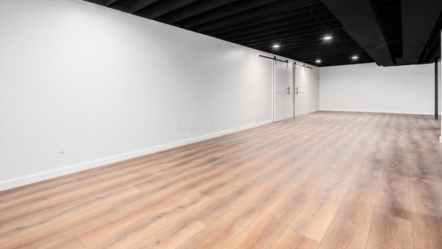 basement with light wood-type flooring