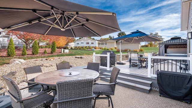 view of patio / terrace featuring a gazebo and a wooden deck