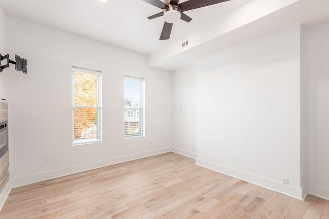 unfurnished room with ceiling fan and light hardwood / wood-style flooring