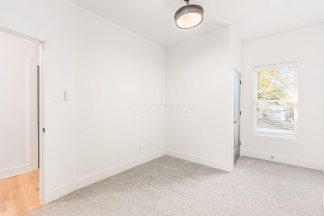 empty room with light colored carpet